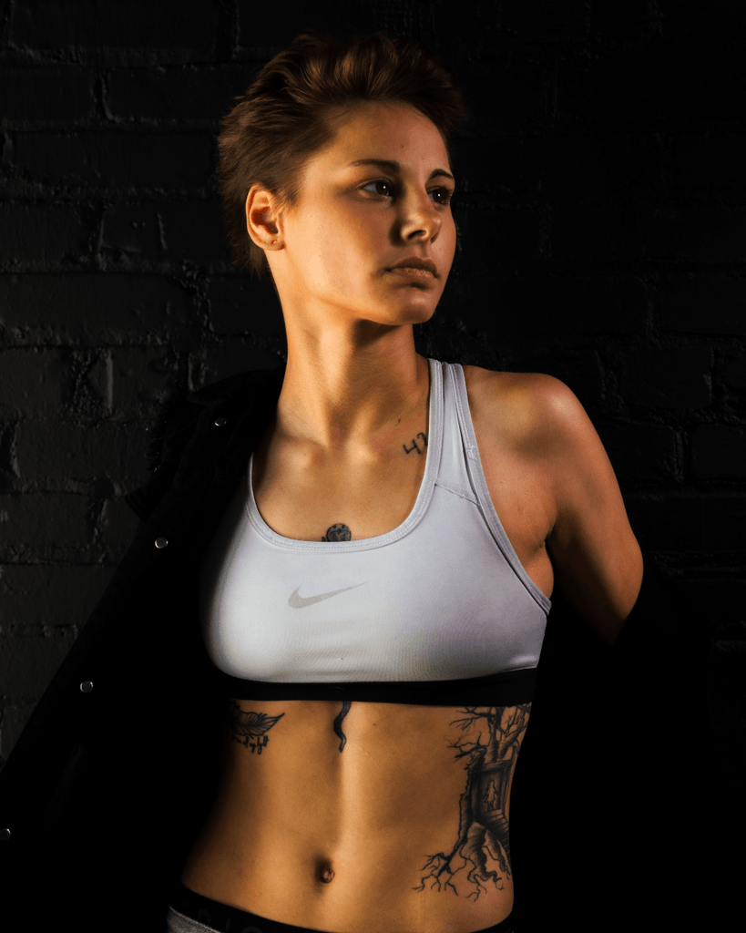 Dark sporty portrait girl in sports bra